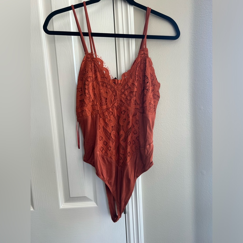 Heyson burnt orange bodysuit.
